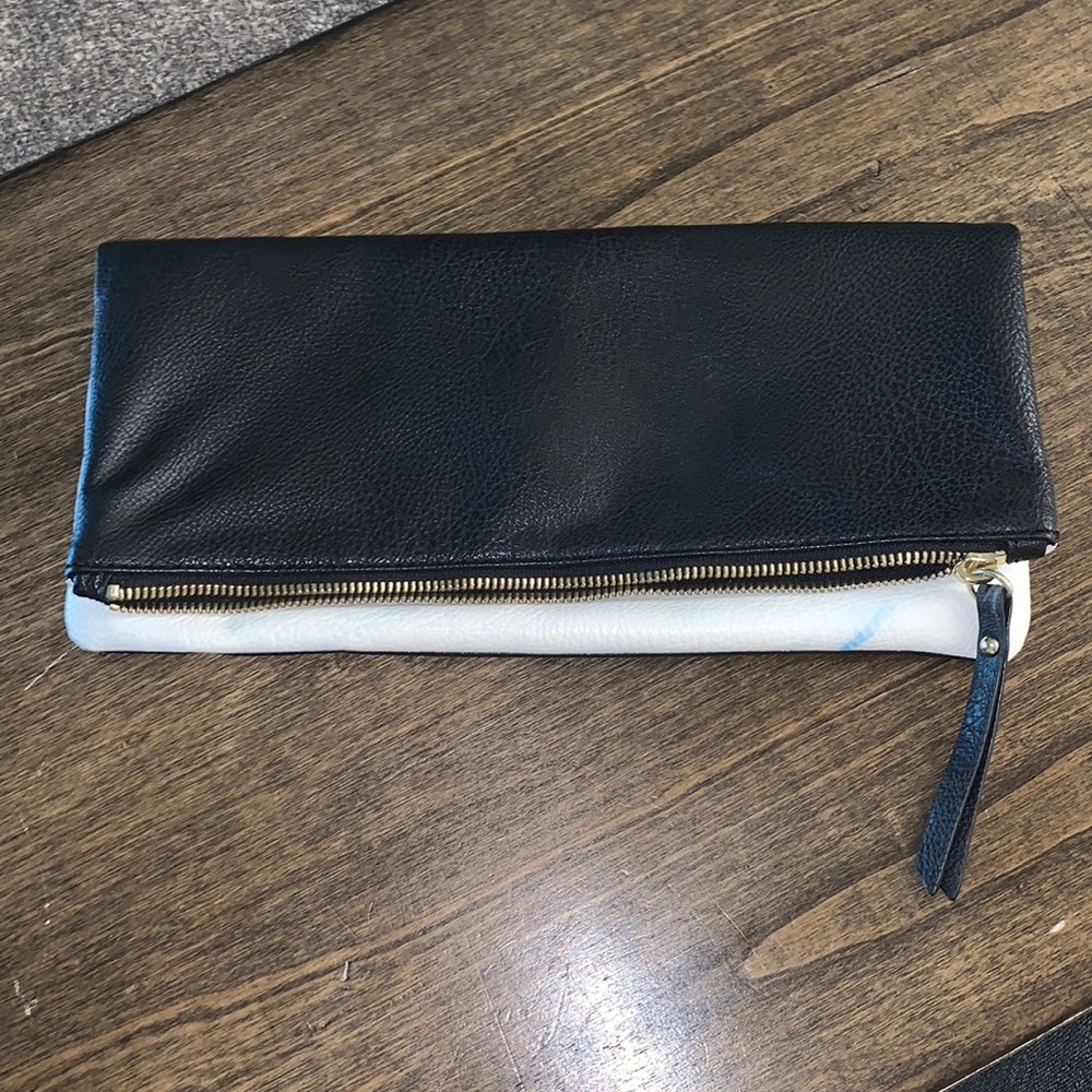 Folding black and white clutch